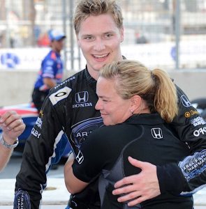 SUCCESS ON THE TRACK Sarah Fisher and driver Josef Newgarden celebrate following a 2013 Baltimore race finish that landed Newgarden on the podium.
