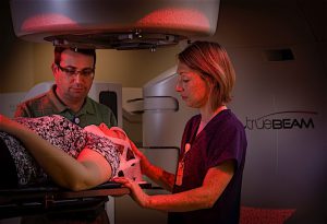 Dan Archambeault, Senior Radiation Physicist, and Jodi Dauby, Chief Radiation Therapist Using the Vision RT infrared guidance system to setup a patient to receive Stereotactic Radiosurgery on the Varian Truebeam linear accelerator