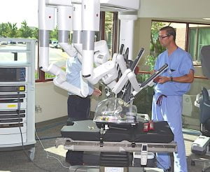 “BETTER FOR THE PATIENT” Eric Woo, DO, of Franciscan St. Anthony Health, says surgeons using robotic technology can handle difficult cases that previously couldn’t be done with small incisions.