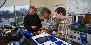 DETECTING BACTERIA Making adjustments to the cellular homogenizer are F Cubed LLC’s Bob Williams, vice president sales and marketing, Chris Chinelli, lead engineer, and Les Ivie, president and CEO.