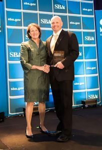 BUSINESS HONORS Dan Schmidtendorff, president and CEO of Communications Company of South Bend, was named Indiana Small Business Person of the Year and was honored in Washington by Karen Mills, former administrator of the Small Business Administration.