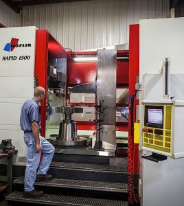 “CONSTANTLY REINVESTING” Schafer Industries, based in South Bend, makes gears and axle assemblies. Pictured here is a gear grinder.