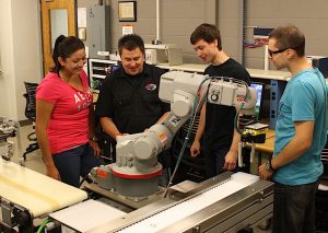 BEST UNIVERSITY FOR OBTAINING A TECHNOLOGY DEGREE Purdue Calumet School of Technology, Hammond. Pictured are Rick Rickerson, College of Technology laboratory administrator (second from left), with students Daniela Ramirez, Bobby Slevnik and Dragan Aleksovski.