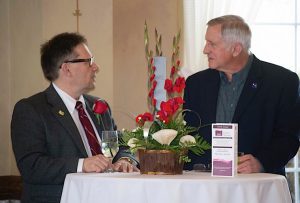 “ALL ABOUT THE ENVIRONMENT” Honoree Geof Benson, executive director of the Dunes Learning Center, speaks with Jim Jessup, facilitator with Leadership LaPorte County.