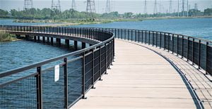 ON THE BOARDWALK The new bike trail at Wolf Lake is among more than $50 million in recent improvements around the lake.
