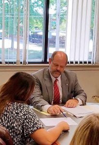 “WE CAN HELP PROVIDE SOLUTIONS,” says Chris Chatfield, vice president of business banking at First Merchants Bank, encouraging business customers to be open about the bad times, not just the good.