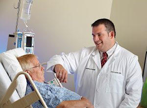 “ALMOST A STANDARD OF CARE” John Lynam, DO, of Porter Physician Group, performs prostate, kidney and bladder surgeries using robotic technology.