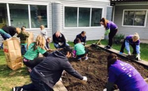Lakefront Career Network organized 150 volunteers for a “Day of Giving” at the Stepping Stone Shelter to assist with landscaping, plumbing, kitchen upgrades and painting.