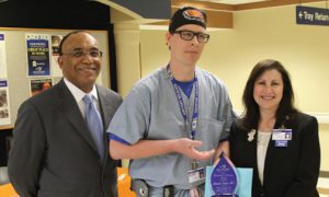 Nursing Excellence and Outstanding Caregiver Awards at Methodist Hospital. Pictured is Raymond Grady, President & CEO, Michael Drake, RN, Winner of Nursing in Excellence Award, Shelly M. Major, Ph.D., RN, NEA-BC, FACHE, Vice President, Chief Nursing Officer.