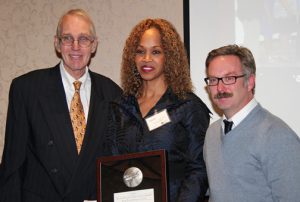 Dr. Danita Johnson Hughes, CEO of Edgewater Behavioral Health Services, accepts an award from The Society of Innovators of Northwest Indiana. Her ultimate goal as CEO is to help make a positive and measurable impact on the region.