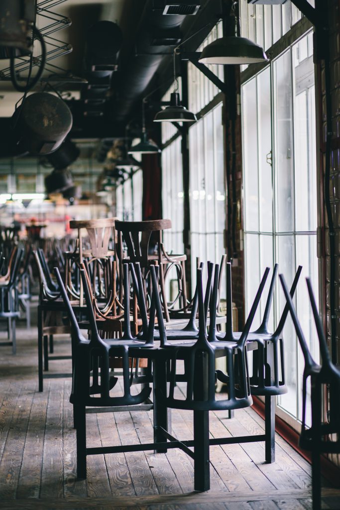 Chairs and tables stacked in a closed pub