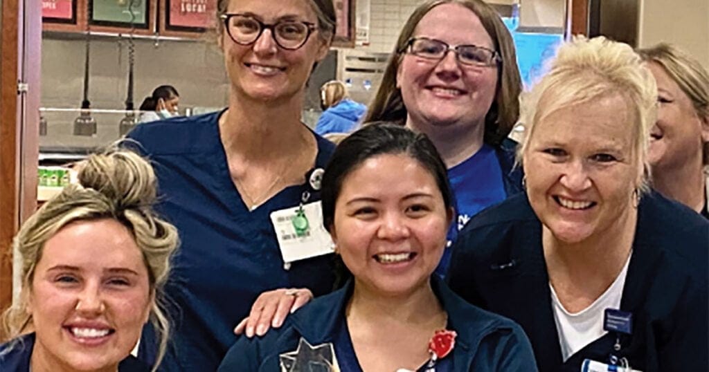 Nursing Excellence Award recipient (center) Ana Ruby